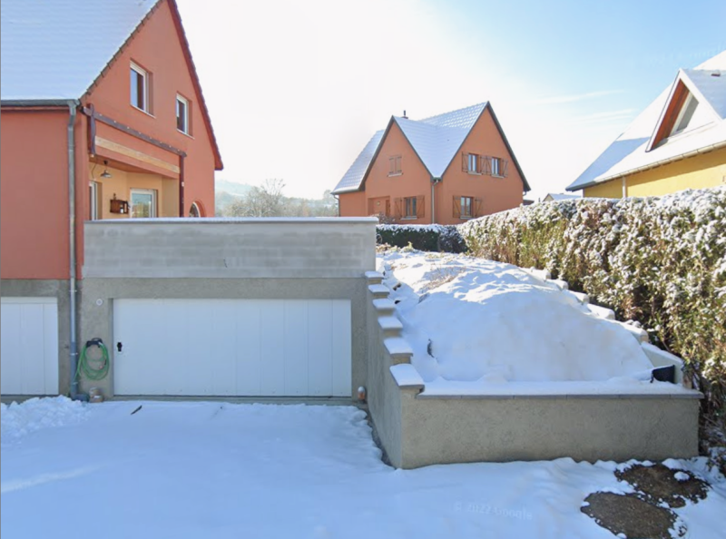 Construction de garage avec murs béton banché, dalle renforcée et caniveau béton à Rosheim dans le Bas-Rhin
